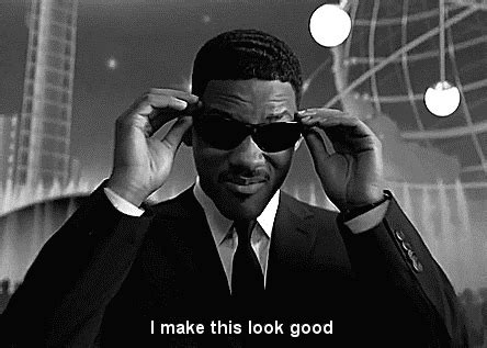 puts on glasses gif